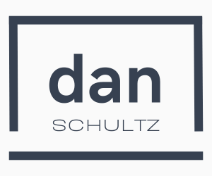 Logo of a person's name written in a laptop outline