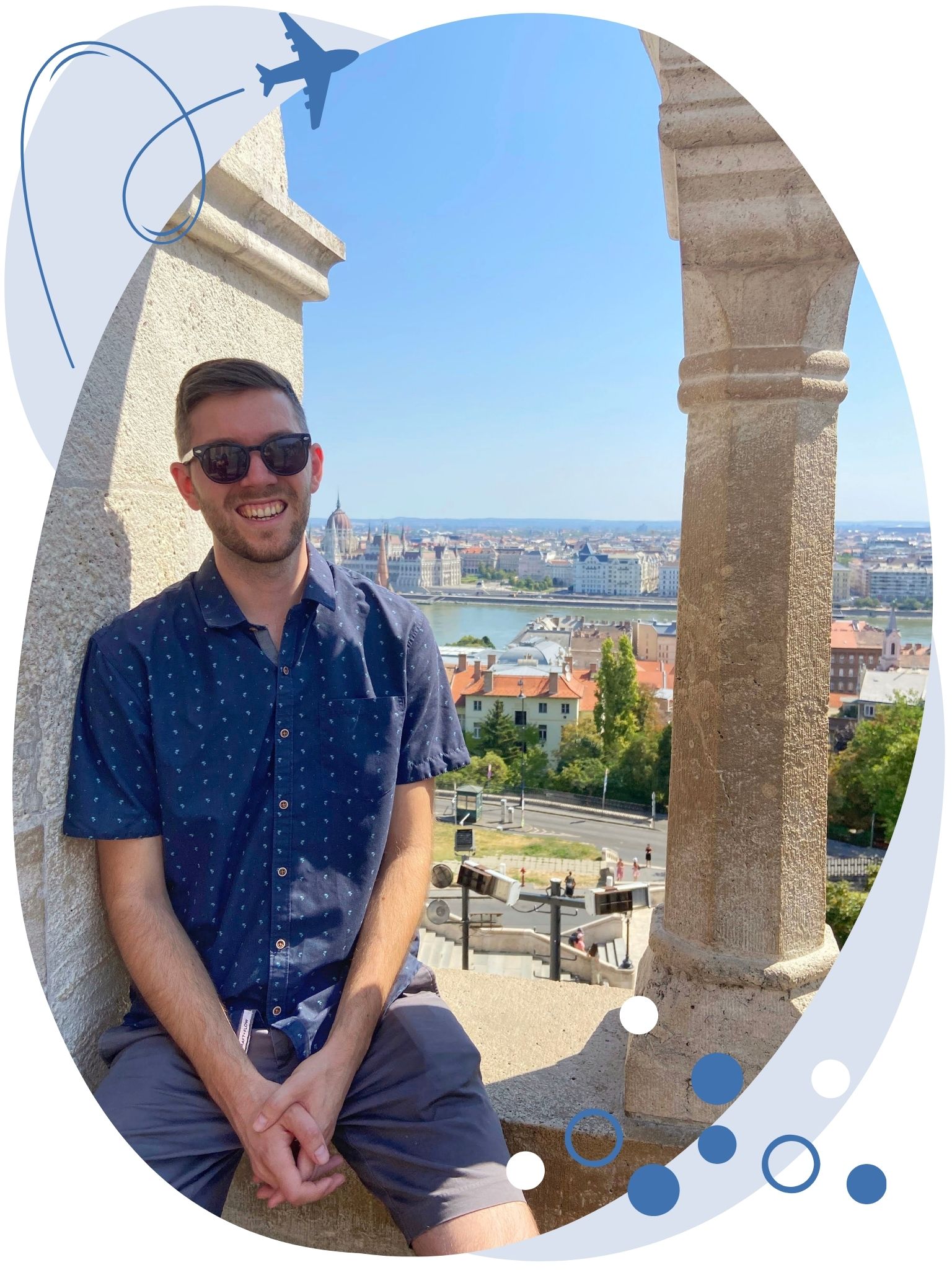 daniel sitting on ledge overlooking city